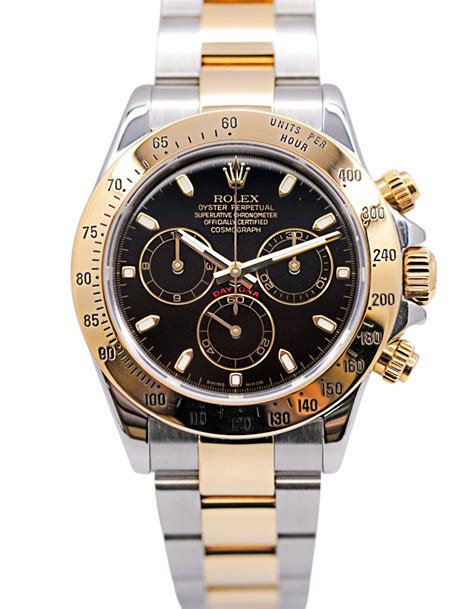 rolex daytona steel gold black dial price|Rolex daytona value chart.